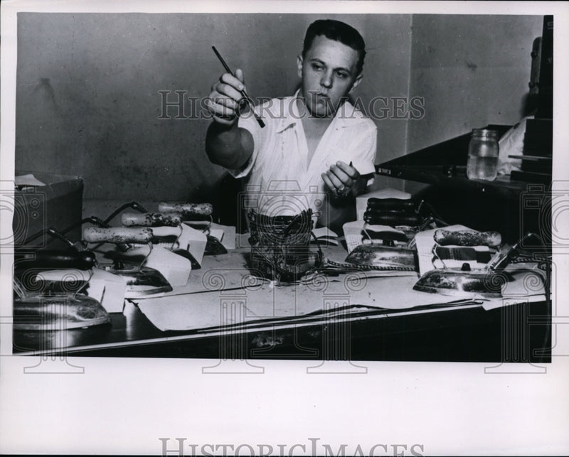 Load image into Gallery viewer, 1955 Press Photo Employee Pasting Photos Onto Passports - nef33031
