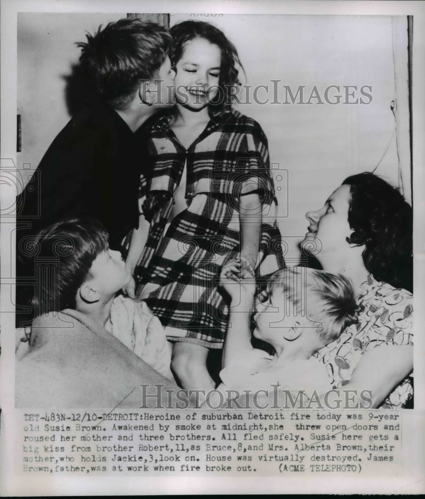 1951 Press Photo Susie Brown & Family Safe After house Fire, Detroit - nef33420