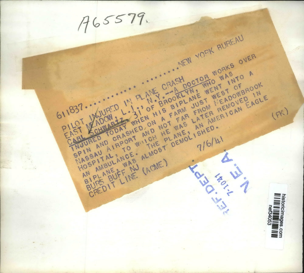 1941 Press Photo Doctor Works Over Carl Schwartz Injured From Biplane Crash