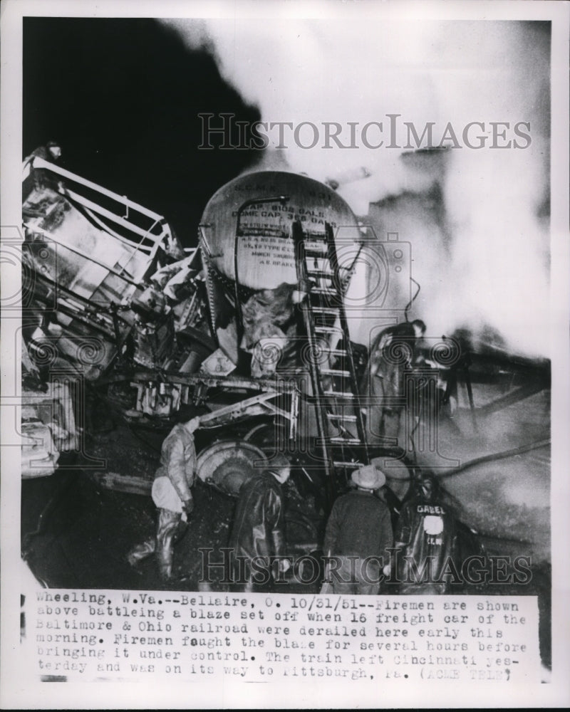 1951 Press Photo Firemen Shown Battling Blaze When Freight Cars Derailed