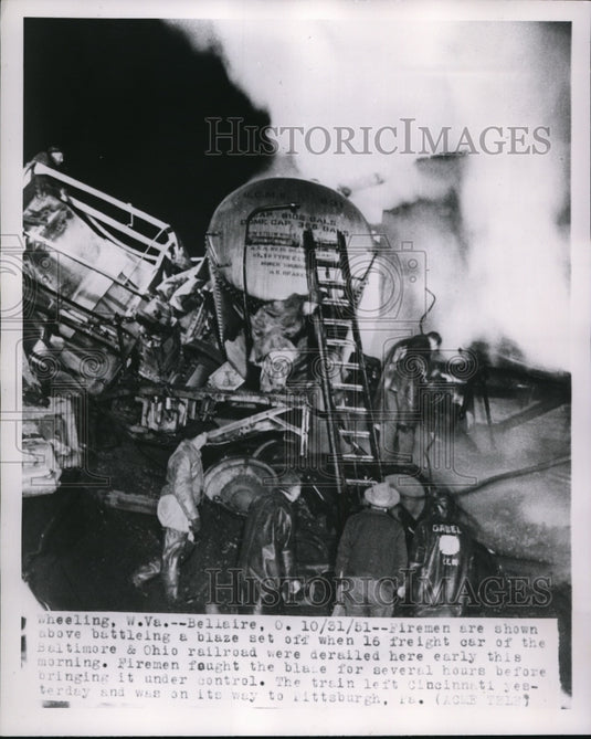 1951 Press Photo Firemen Shown Battling Blaze When Freight Cars Derailed