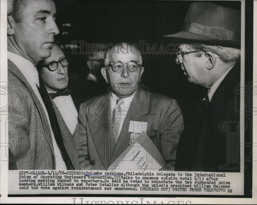 1956 Press Photo Columbo Acchione talks to newsmen outside hotel - nef36058