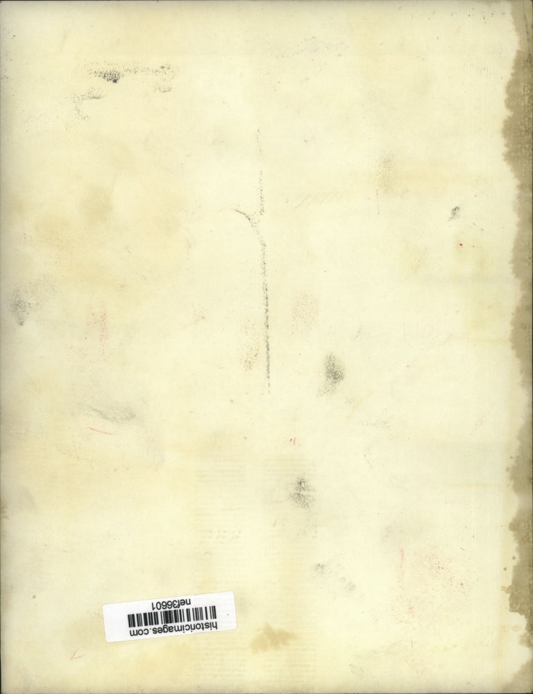 Press Photo Two men move a foldaway mattress into a building - nef36601