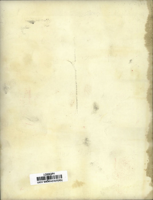 Press Photo Two men move a foldaway mattress into a building - nef36601