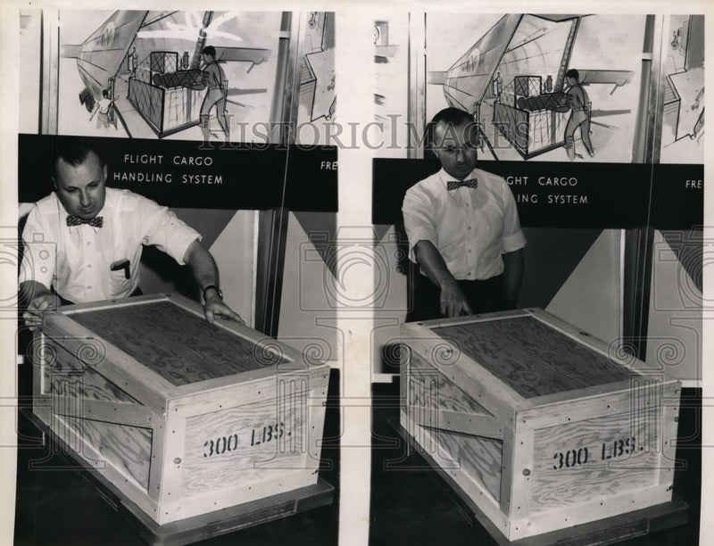 Load image into Gallery viewer, 1962 Press Photo Marvin F DeBoy Strains to Shove 300-Pound Load Across Floor
