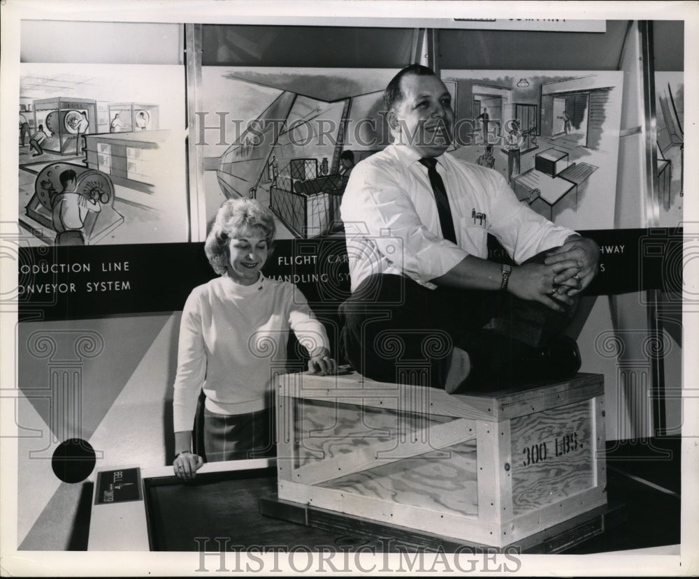 1962 Press Photo Joseph Aiello Sits Atop 200-Pound Load as Irma Bilich Moves It