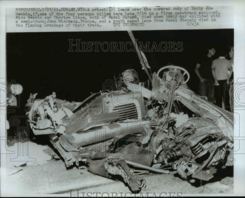Load image into Gallery viewer, 1961 Press Photo Durand, WI A Priest Looks Over Bobby Joe Wekkin's Covered Body
