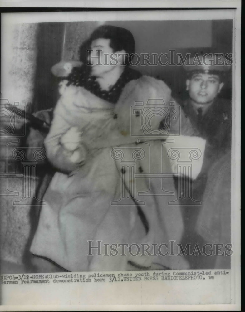 Load image into Gallery viewer, 1956 Press Photo Youth arrested during Communist led anti German Rearmament Riot
