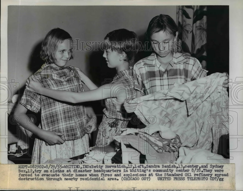 Load image into Gallery viewer, 1955 Press Photo Children Try on Clothes at Disaster Headquarters in Whiting
