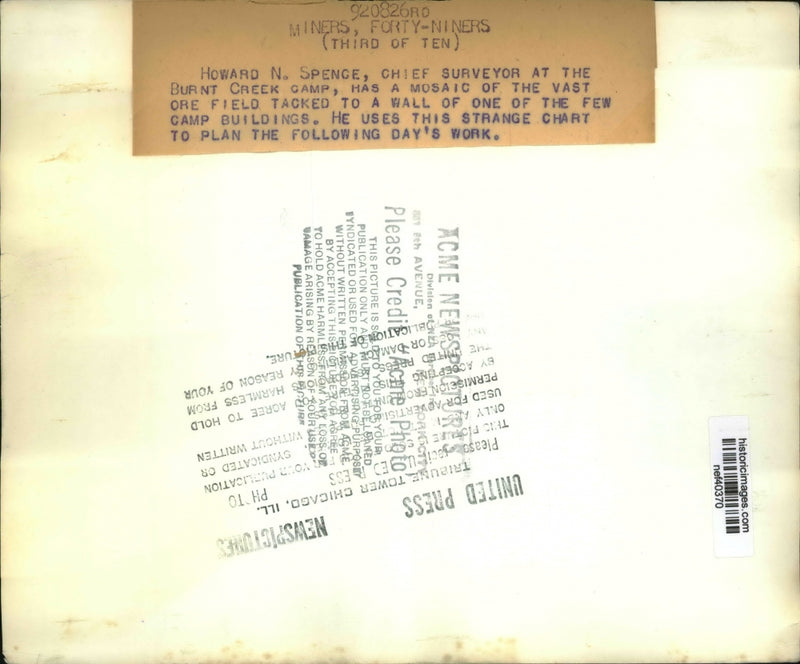 Load image into Gallery viewer, Press Photo Howard N Spence Has Mosaic of Vast Ore Field Tacked to a Wall
