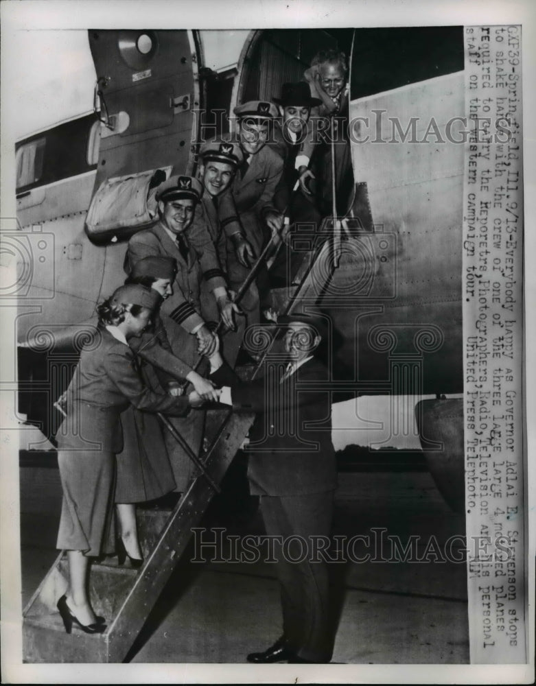 1952 Press Photo Stevenson stops to shake hands with 4 motored plane crew