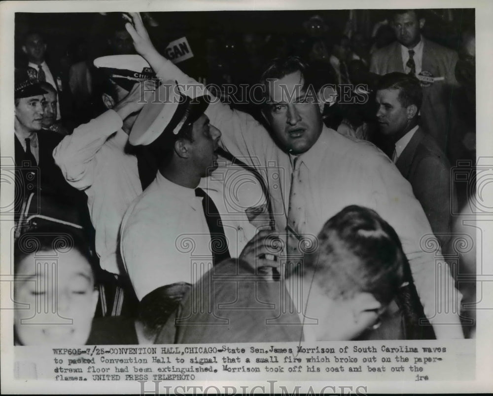 1952 Press Photo Sen James Morrison Waves to Signal Fire on Paper Strewn Floor