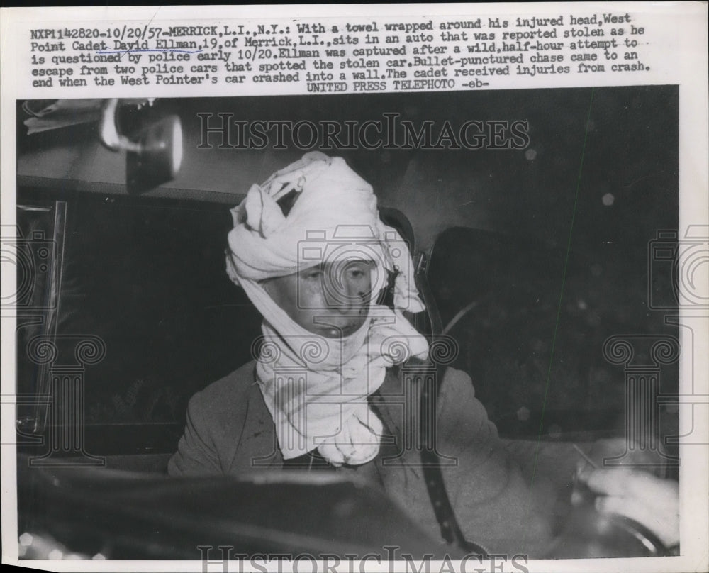 1957 Press Photo David Ellman sits in an auto that was reported stolen