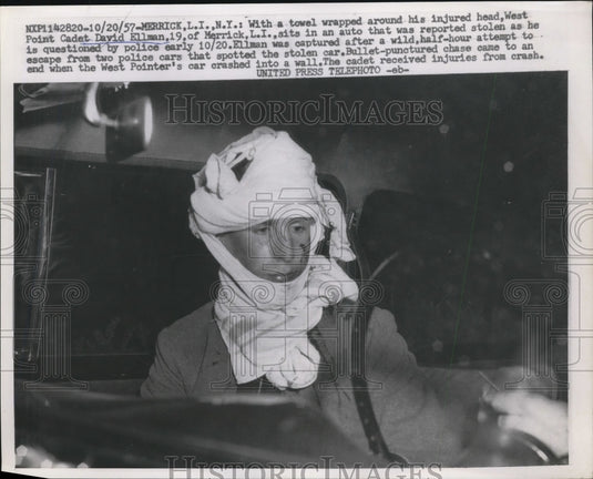 1957 Press Photo David Ellman sits in an auto that was reported stolen