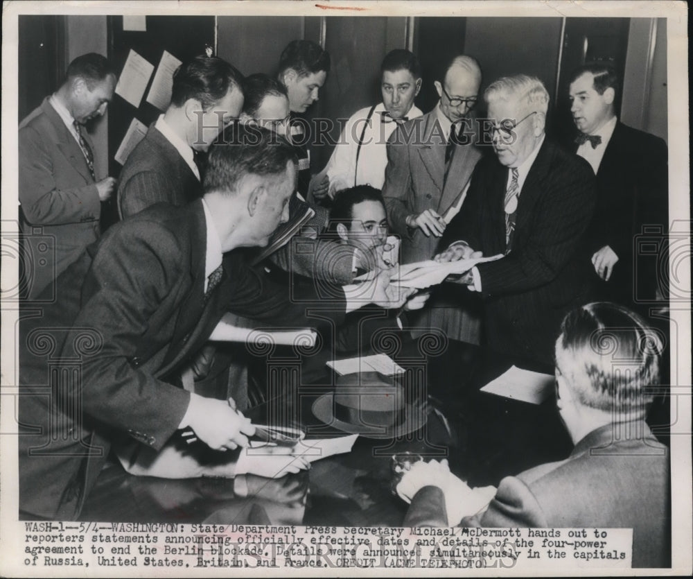1949 Press Photo Michael McDermott Hands Out Details of Four-Power Agreement
