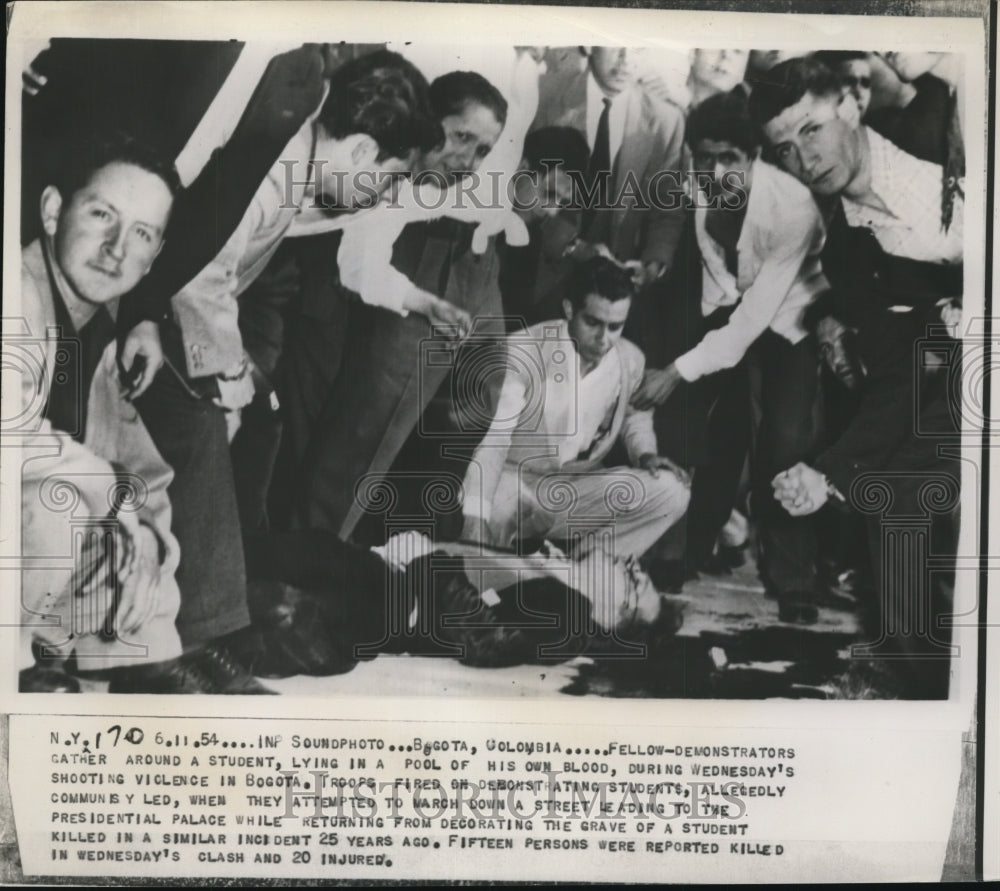 1954 Press Photo Demonstrators Gather Around Student Lying in Pool of His Blood