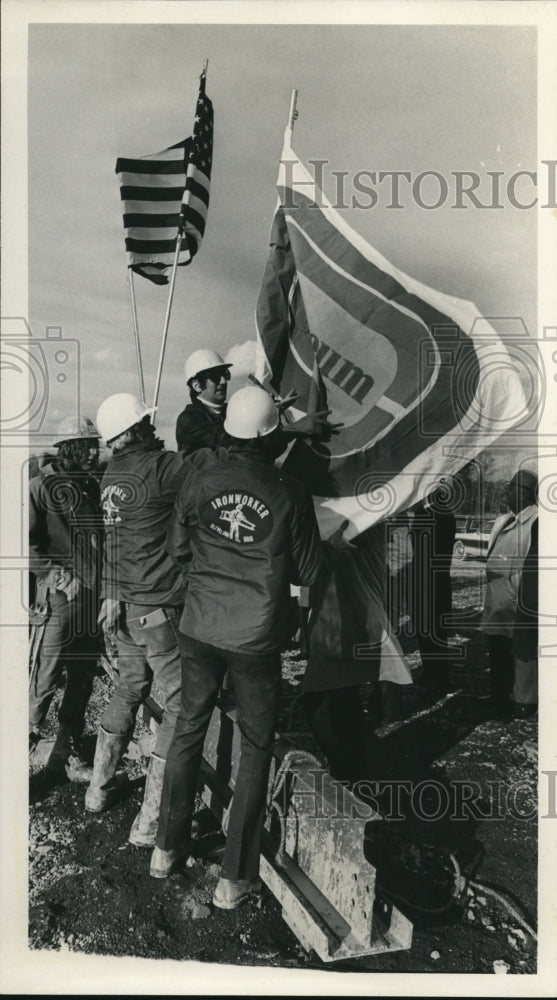 Load image into Gallery viewer, 1973 Press Photo Flags Being Raised by Iron Workers - nef43848
