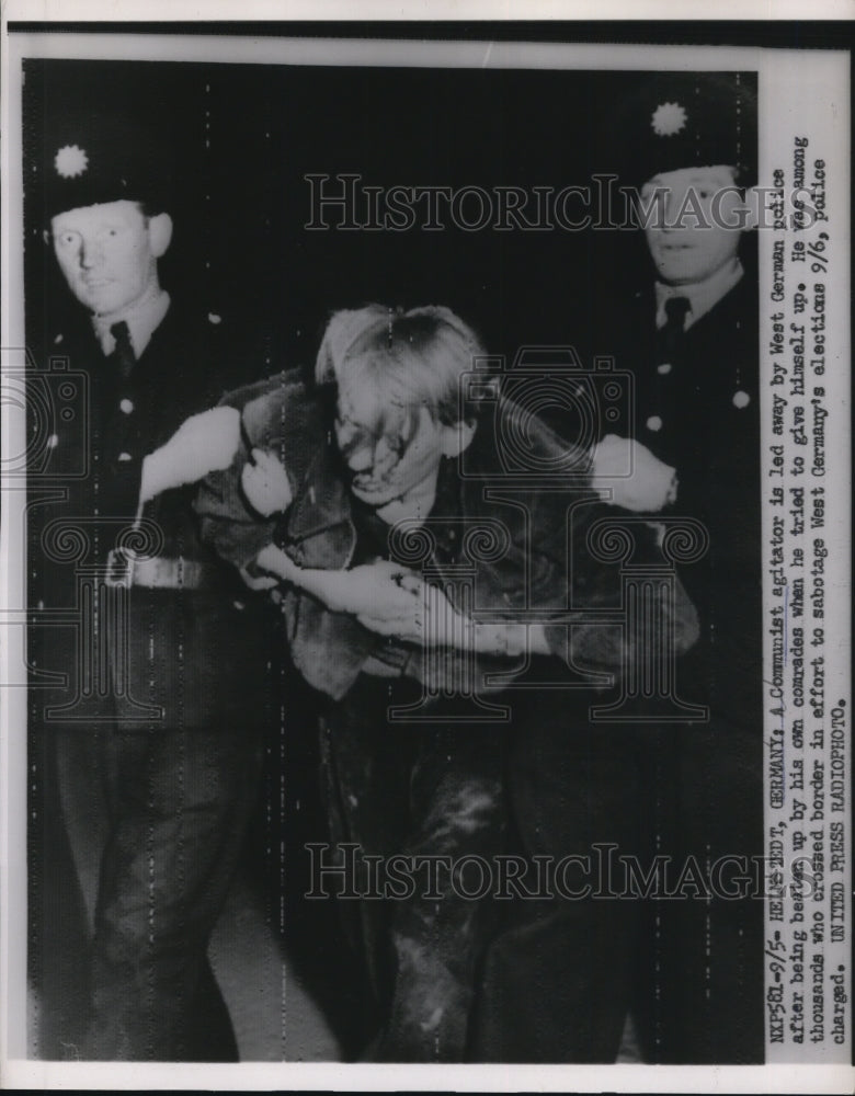 1953 Press Photo Communist Agitator Taken by West German Police, Helmstedt