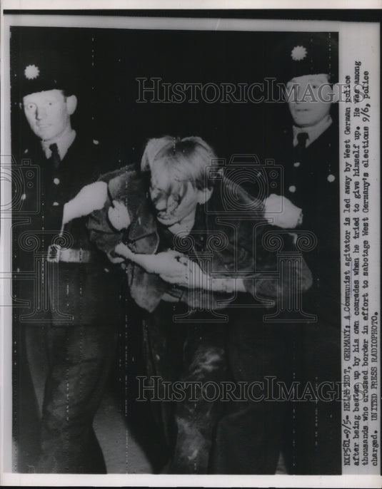 1953 Press Photo Communist Agitator Taken by West German Police, Helmstedt