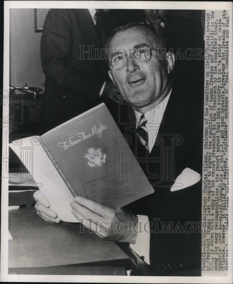 Load image into Gallery viewer, 1947 Press Photo Charles Wilson Civil Rights Chairman w/ Human Freedom Report
