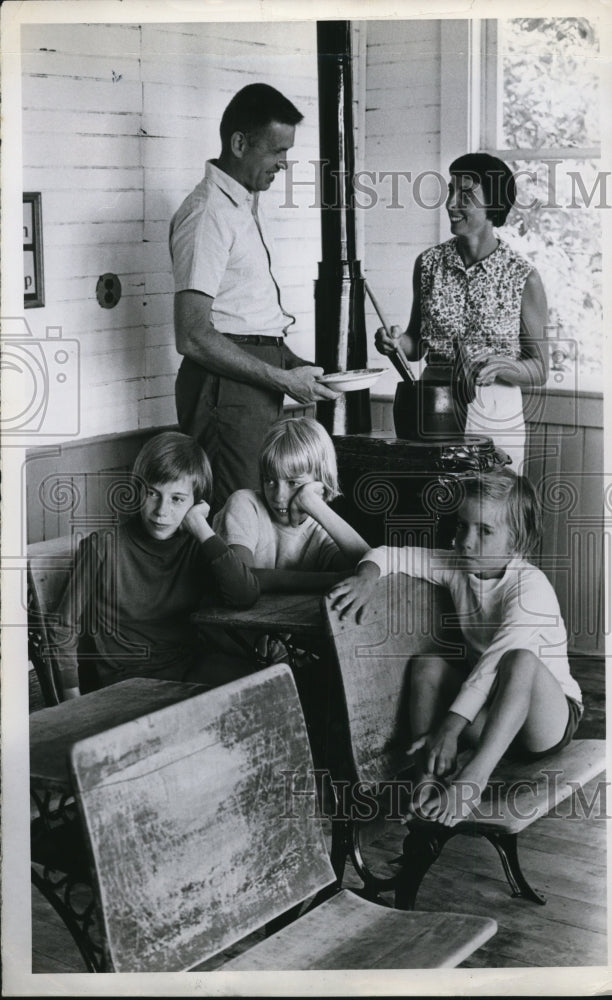 Load image into Gallery viewer, 1966 Press Photo Mr &amp; Mrs Clark Hollerford Use Pot Belly Stove &amp; Melinda, Nancy
