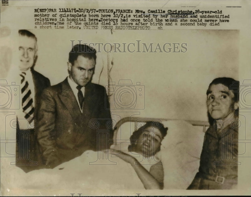 Load image into Gallery viewer, 1957 Press Photo Mrs Camille Christopher Mother of Quintuplets Visted by Husband
