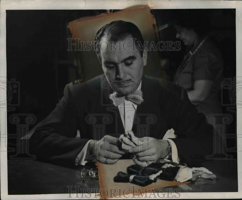 Load image into Gallery viewer, 1946 Press Photo Michael Roberts Inserts Tie Clips on Russian Ermine
