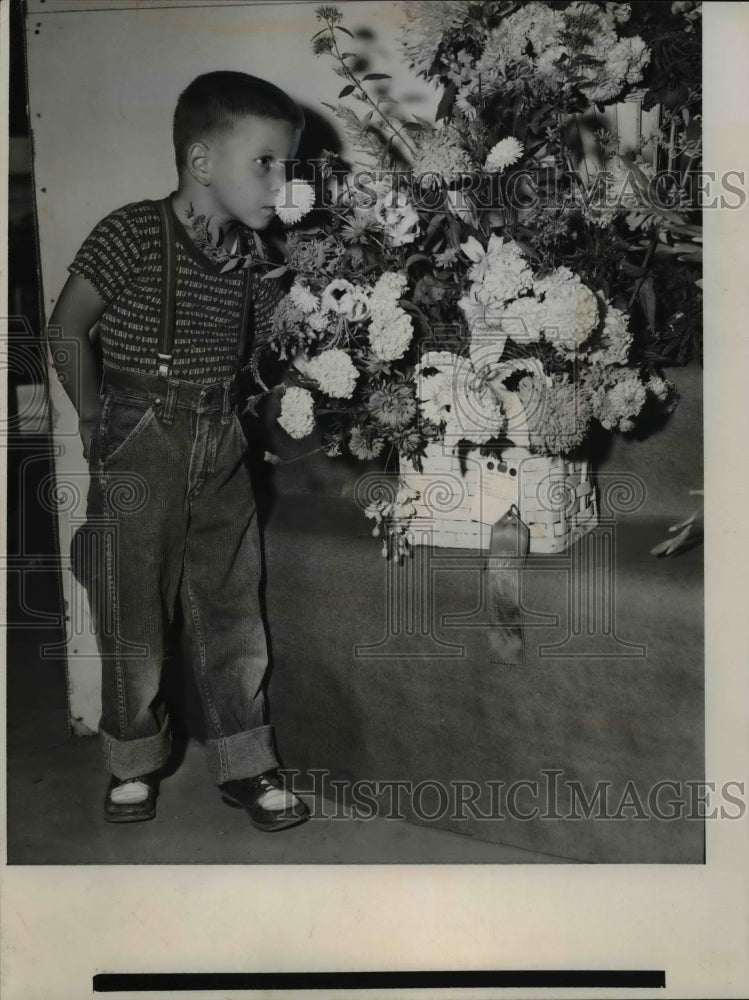 Load image into Gallery viewer, 1955 Press Photo Boy Billy dominish Smelling Flowers at Lake County Fair, Ohio
