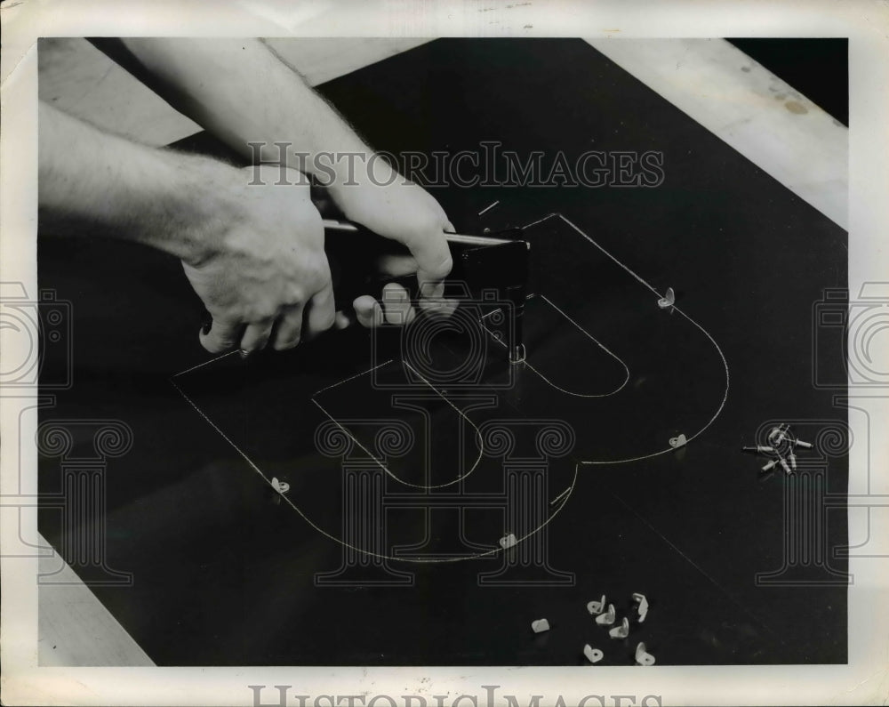 Press Photo Riveting the Clips Into Holes with Cold Rivets - nef45876
