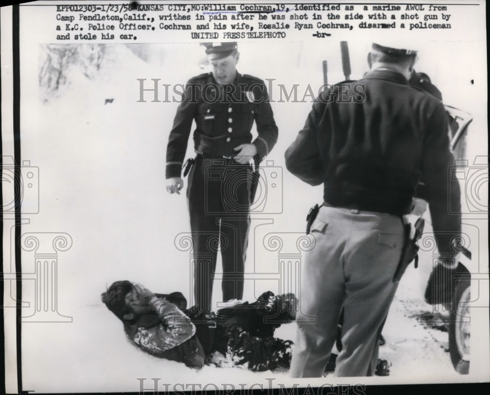 1958 Press Photo William Cochran writhes in pain after being shot in the side