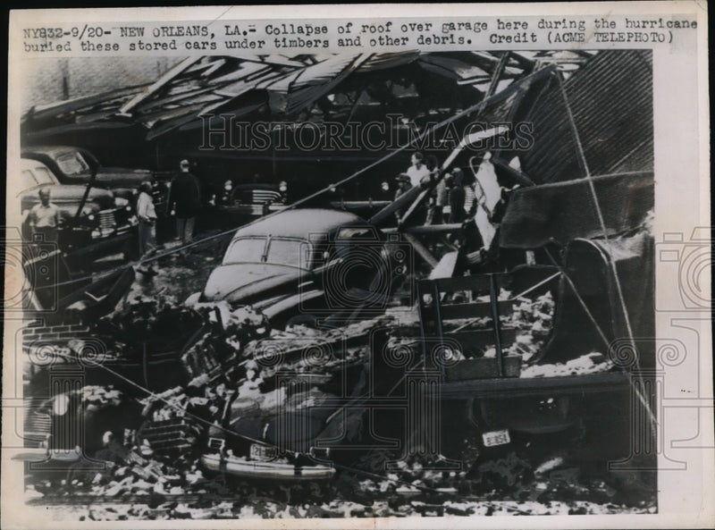 Load image into Gallery viewer, 1949 Press Photo Collapsed of roof over garage during Hurricane in New Orleans
