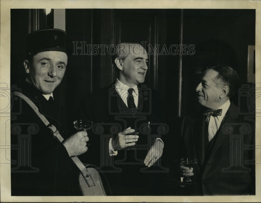 1957 Press Photo Abel Charbonnier Shown Sipping Champagne During Reception