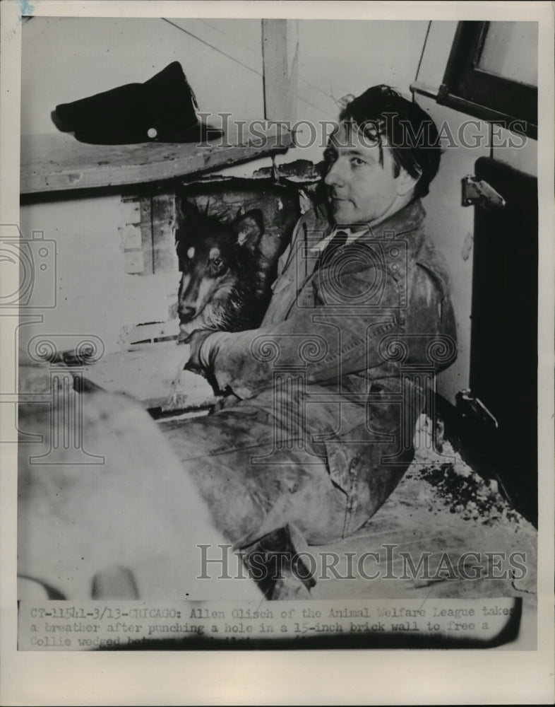 Load image into Gallery viewer, 1951 Press Photo Allen Glisch takes a breather after punching a hole in a wall
