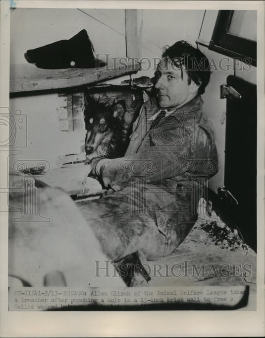 1951 Press Photo Allen Glisch takes a breather after punching a hole in a wall