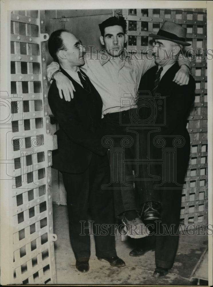 Load image into Gallery viewer, 1938 Press Photo Robert Shaw Shown as He was Carried Into Court to Plead Guilty

