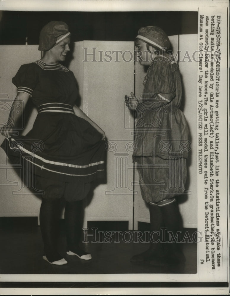 1957 Press Photo Artner, Stark model suits form Detroit Historical Museum