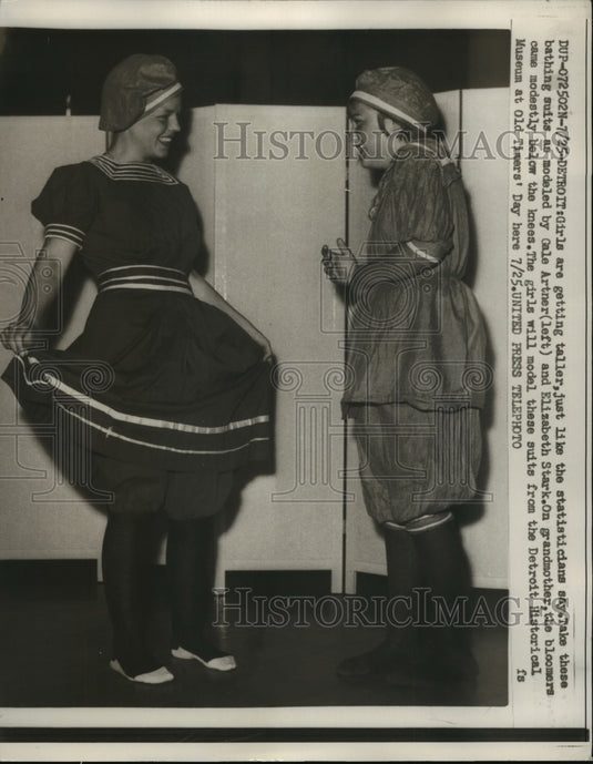 1957 Press Photo Artner, Stark model suits form Detroit Historical Museum