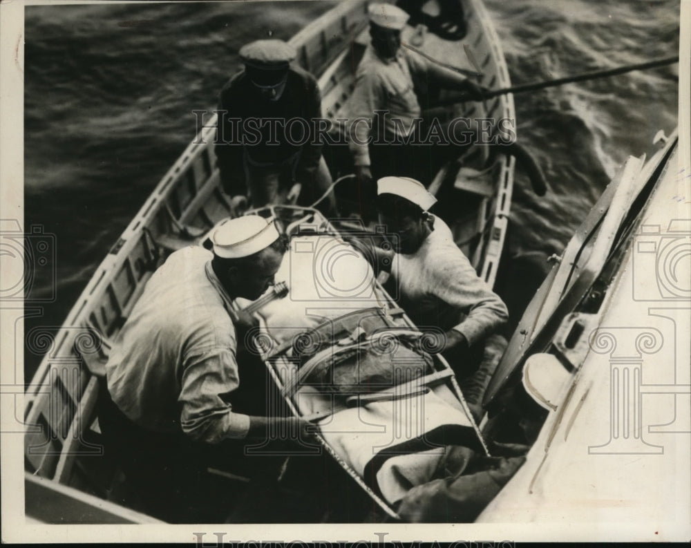1938 Press Photo Peterson's Transfer From Cutter to Plane of Biloxi Air Station