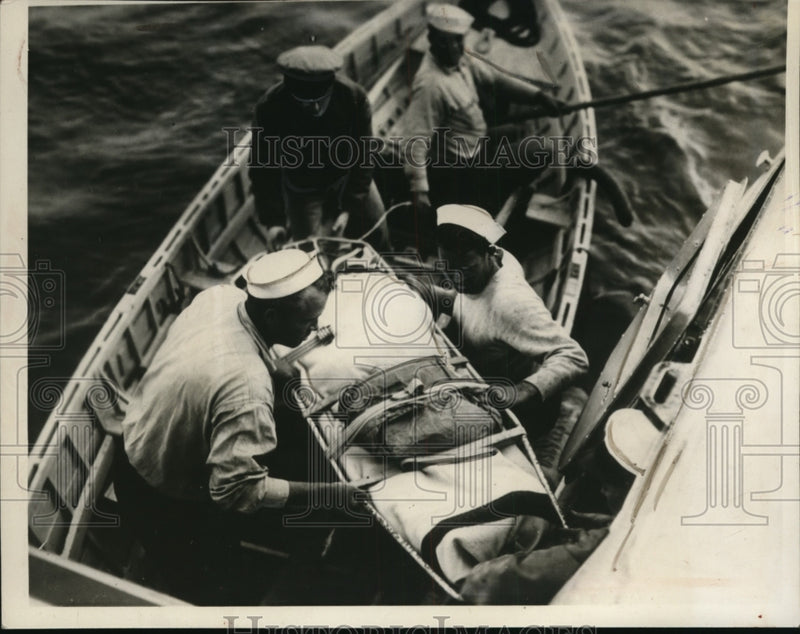 Load image into Gallery viewer, 1938 Press Photo Peterson's Transfer From Cutter to Plane of Biloxi Air Station
