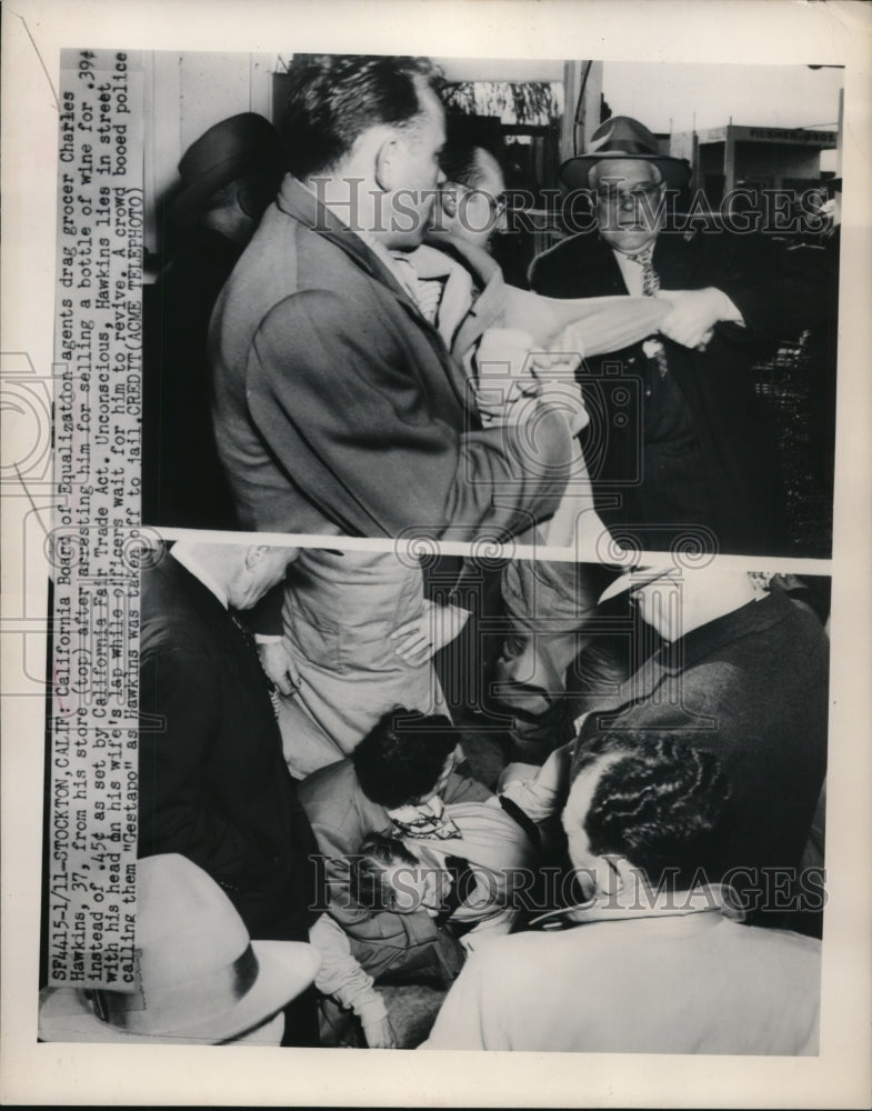 1950 Press Photo Charles Hawkins dragged from his store - nef53092