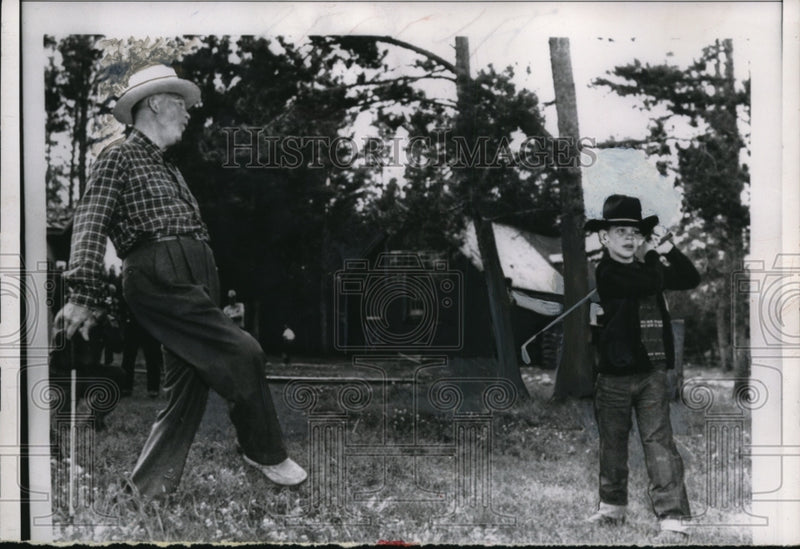 Load image into Gallery viewer, 1955 Press Photo Pres Eisenhower Adds Body English to David Eisenhower's Swing
