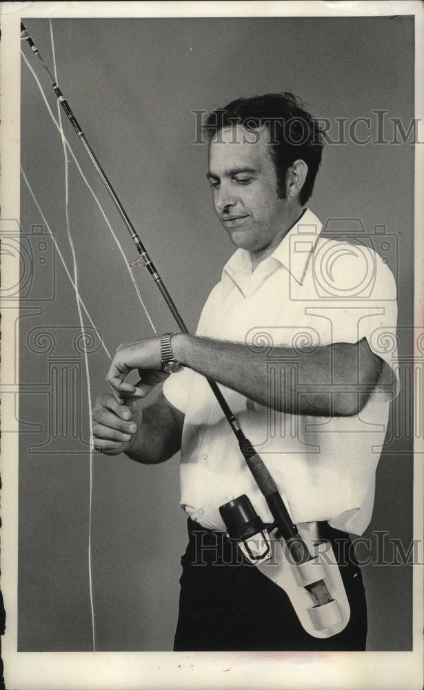 Load image into Gallery viewer, 1973 Press Photo Low Hanzel &amp; Rod Holster Fishing Pole - nef53351
