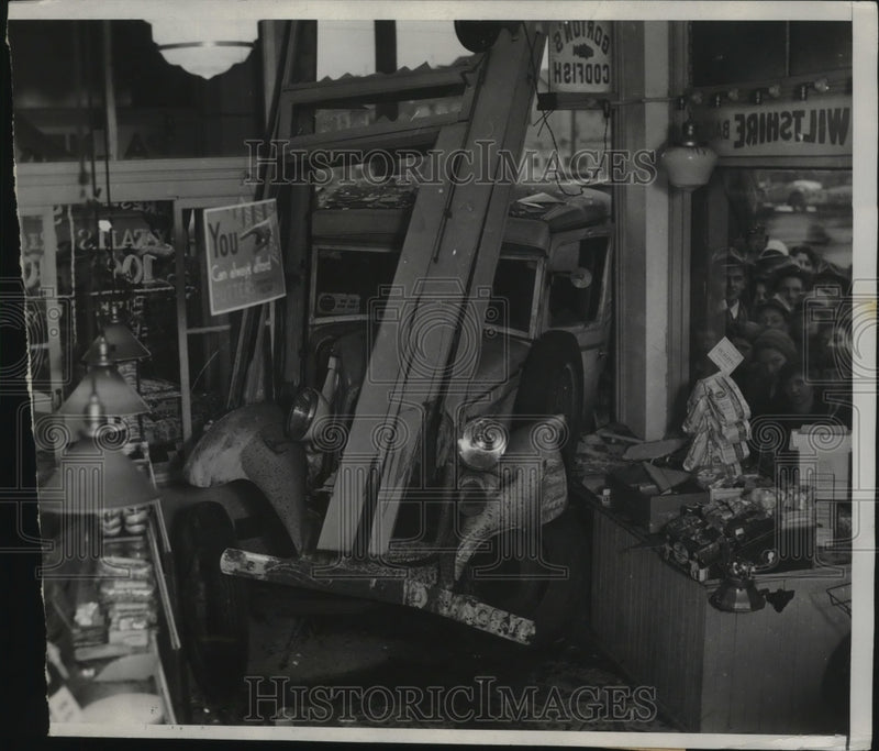 Load image into Gallery viewer, 1934 Press Photo Truck Crashed Through Front of Cleveland Meat Market
