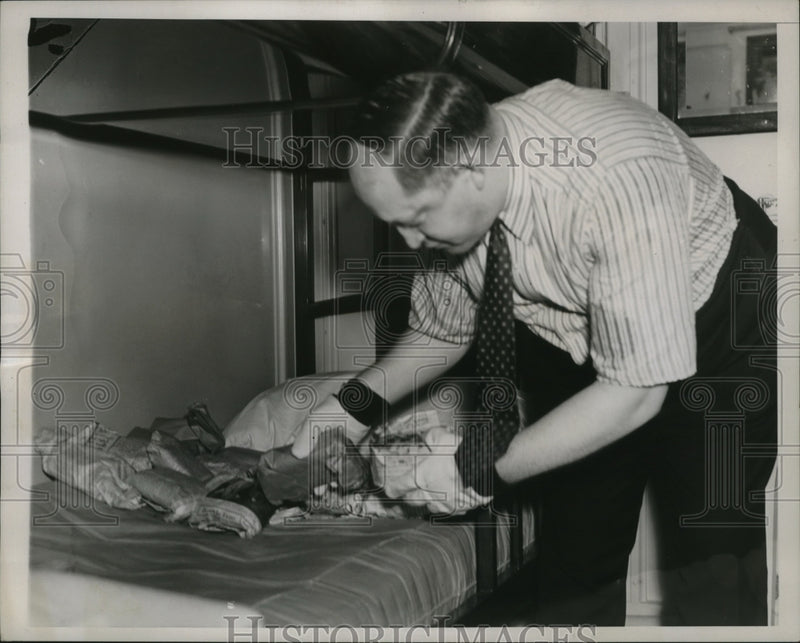 Load image into Gallery viewer, 1937 Press Photo Abraham Eisenberg Piled Packages as Fast as They Were Removed
