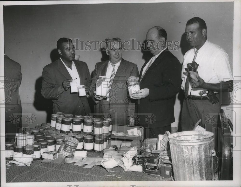 1957 Press Photo Patrick Deeley, Joseph Healy hold a jar of pure heroin