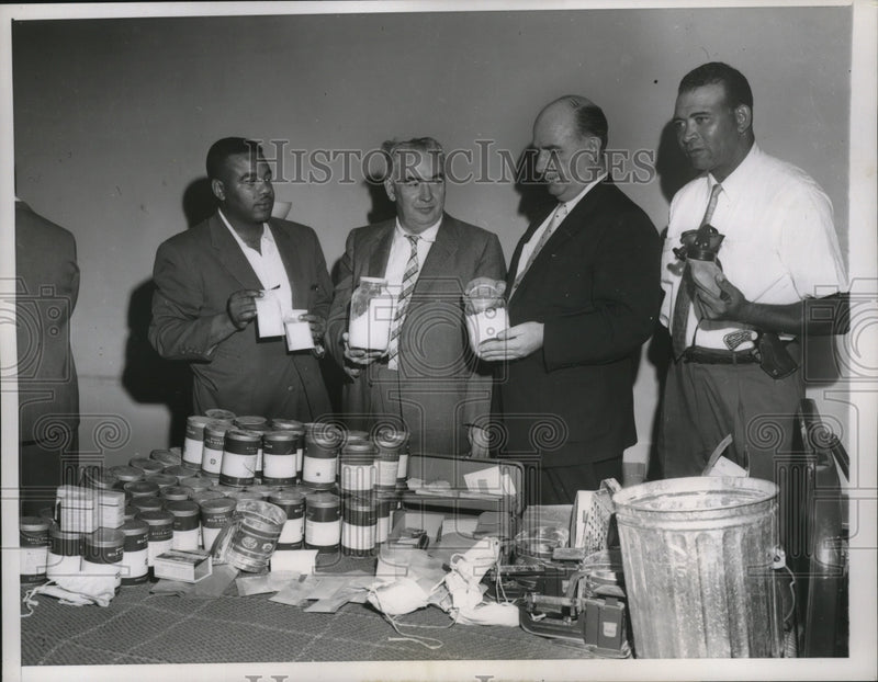 Load image into Gallery viewer, 1957 Press Photo Patrick Deeley, Joseph Healy hold a jar of pure heroin
