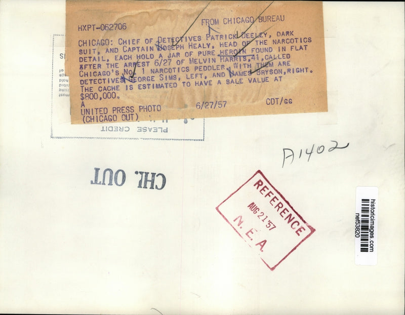 Load image into Gallery viewer, 1957 Press Photo Patrick Deeley, Joseph Healy hold a jar of pure heroin
