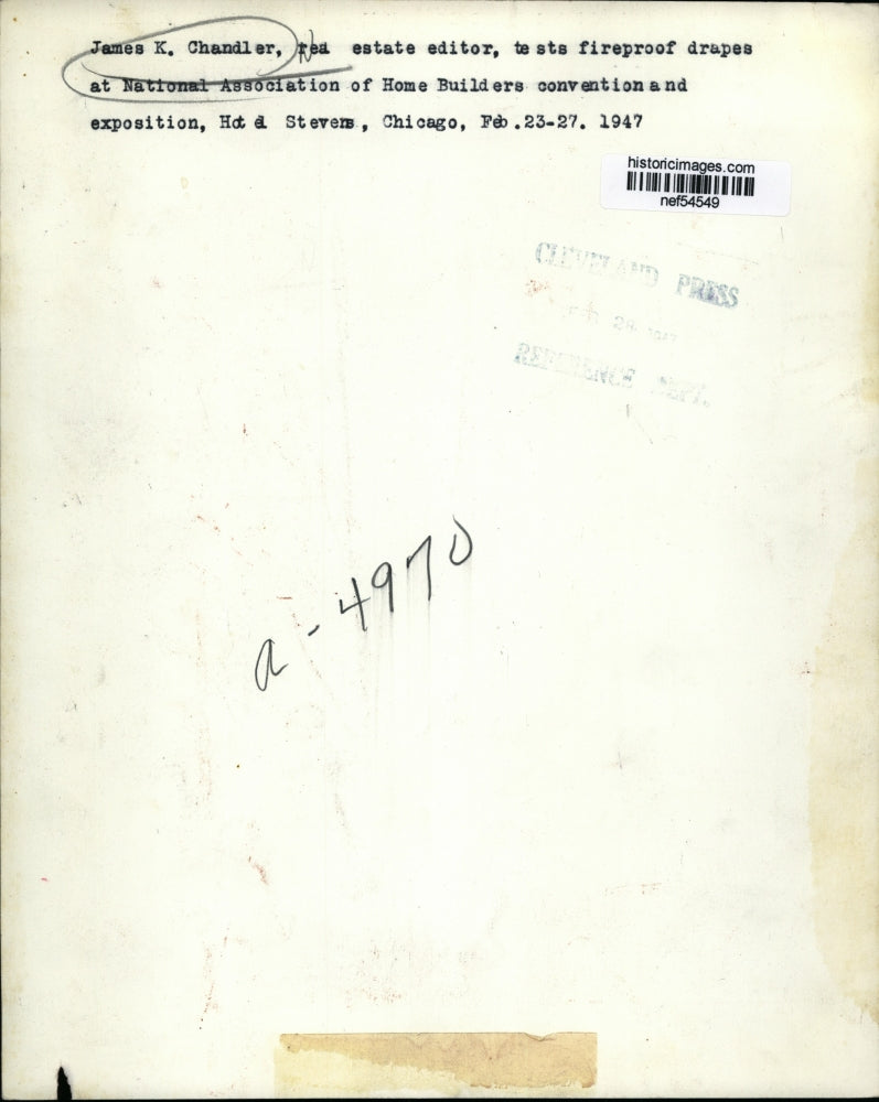 1947 Press Photo James K. Chandler test fireproof drapes - nef54549