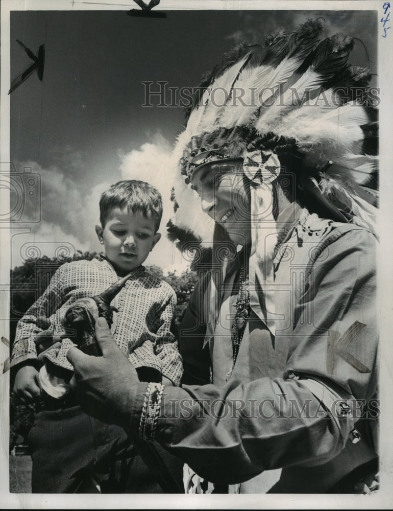 Load image into Gallery viewer, 1965 Press Photo Iroquois Chief Frank Kirby Showing Boy His Shillelagh

