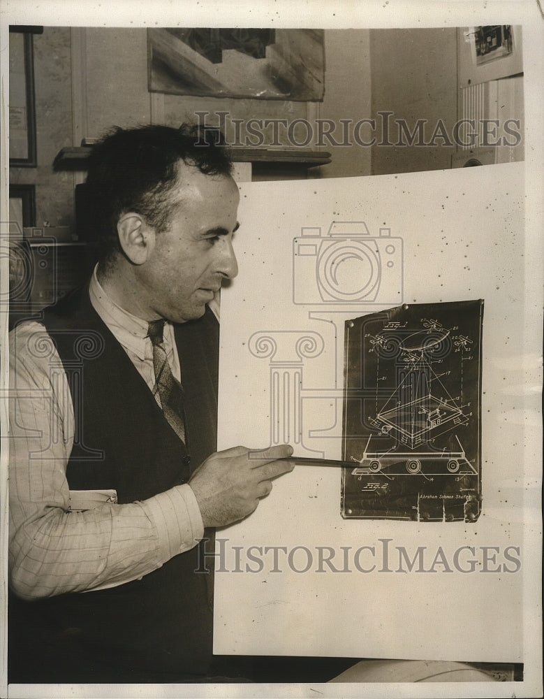 1938 Press Photo Shafer points to his plans for a floating airplane dock